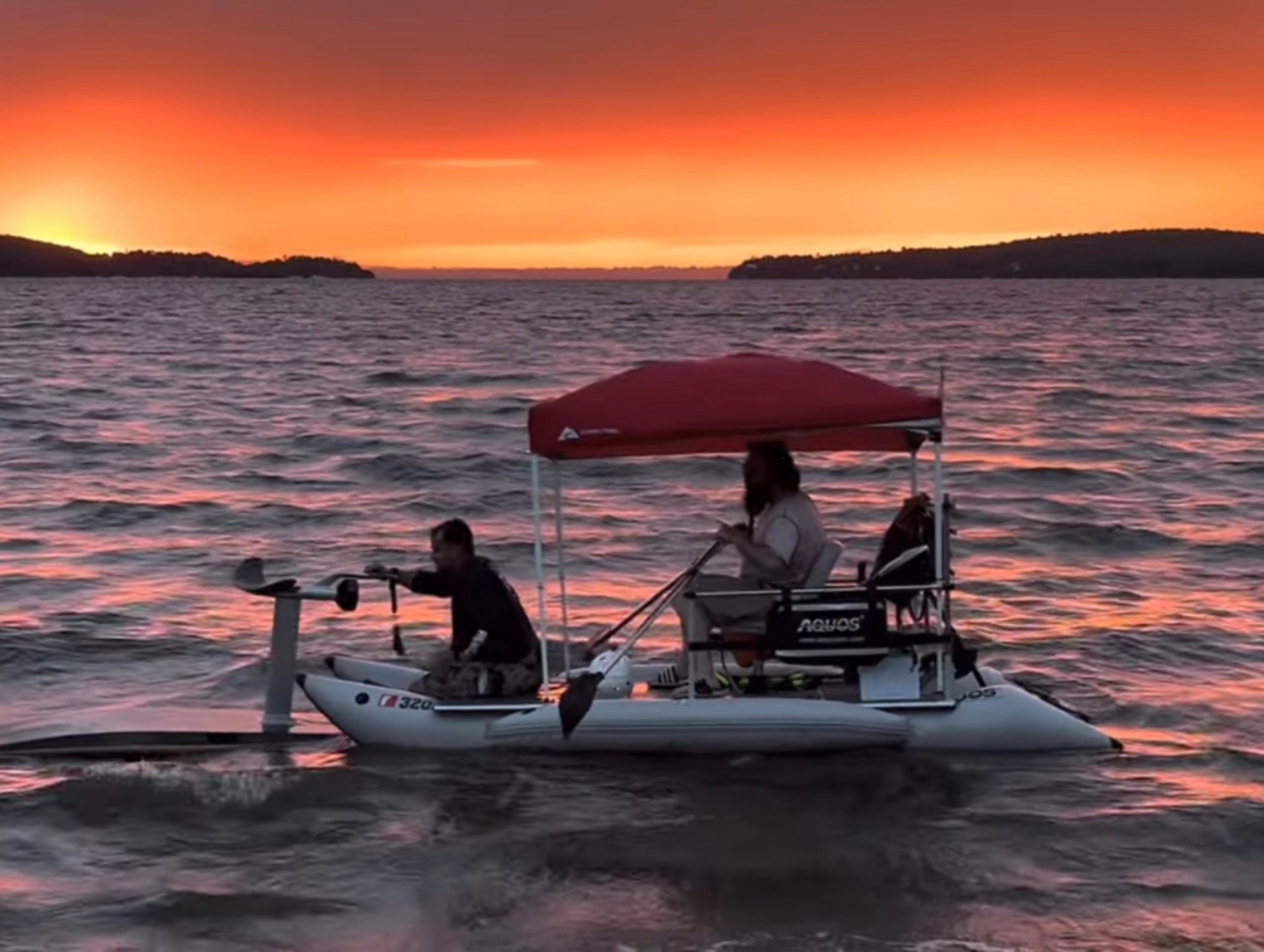 MikeRaft with red bimini under evening light